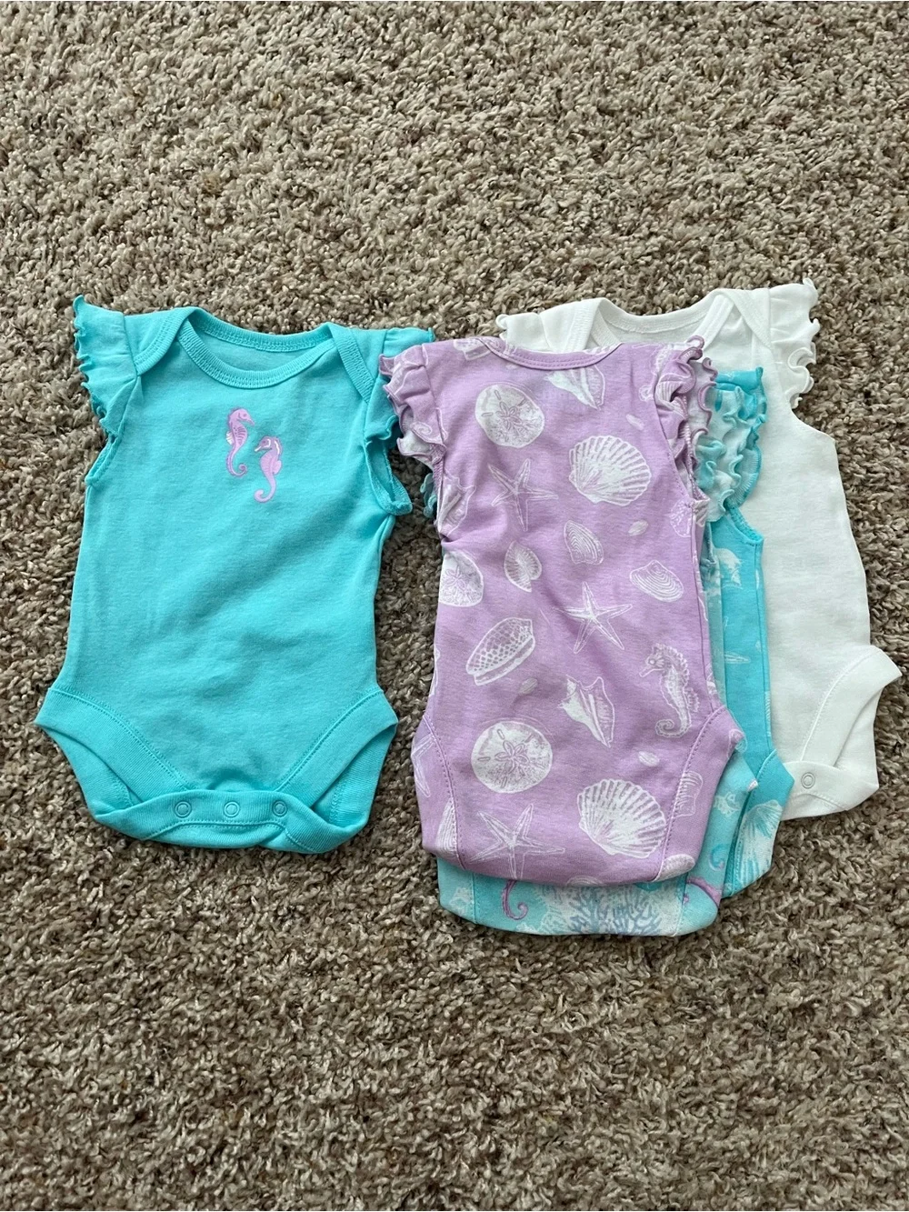 The Children’s Place Newborn 5 Bodysuits & 3 Shorts Set in Pastel Seashell Print